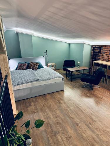 Un ou plusieurs lits dans un hébergement de l'établissement Apartament Przystań