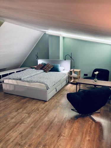 Un ou plusieurs lits dans un hébergement de l'établissement Apartament Przystań