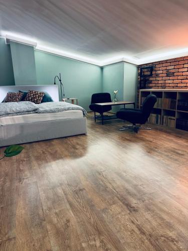 Un ou plusieurs lits dans un hébergement de l'établissement Apartament Przystań
