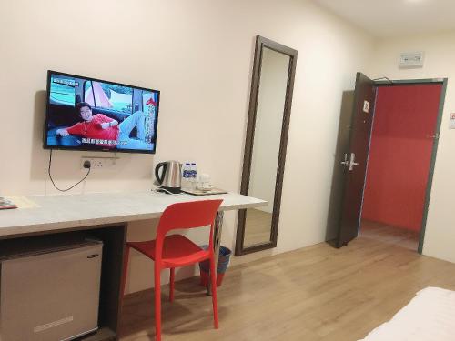 Телевизор и/или развлекательный центр в GPI HOTEL Bentong