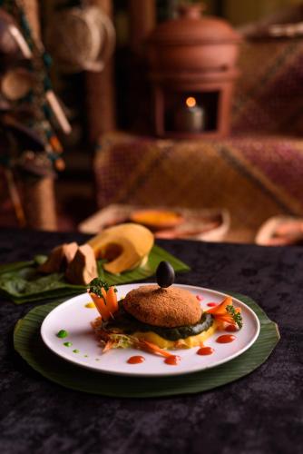 a plate of food sitting on a table at Oak Ray Colombo City Hotel in Colombo