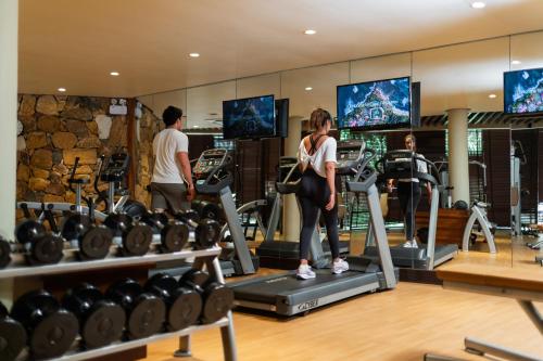 a woman on a treadmill in a gym at Cape Weligama - Relais and Chateaux in Weligama