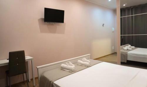 Postel nebo postele na pokoji v ubytování B&B Oasi Isonzo