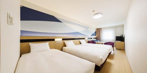 Katil atau katil-katil dalam bilik di HOTEL DREAM GATE maihama