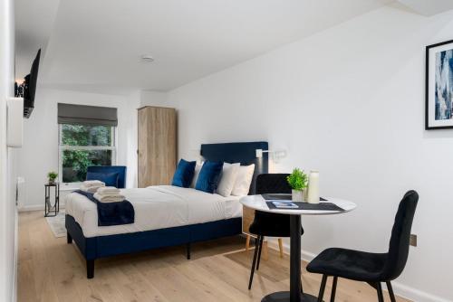 Ένα ή περισσότερα κρεβάτια σε δωμάτιο στο GuestReady - Greenwich Park Studios