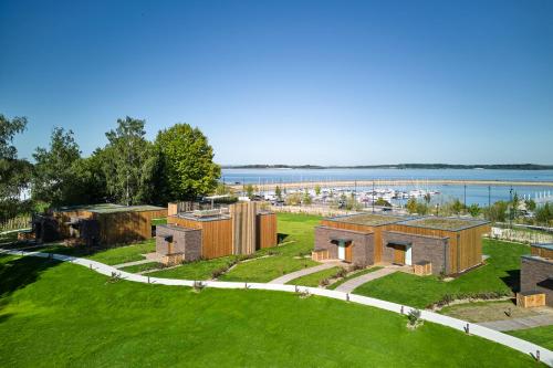 an aerial view of a house with the water in the background at Le Rêve - Hôtel Luxe in Mesnil-Saint-Père