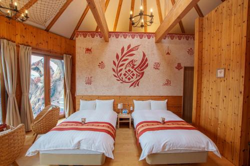 two beds in a room with wooden walls at GRAND CHARIOT Hokutoshichisei 135° in Awaji