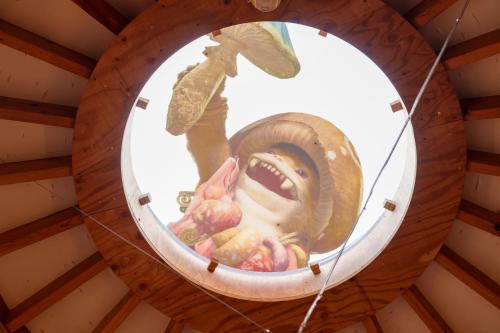 a mirror with a picture of a person in a hat at GRAND CHARIOT Hokutoshichisei 135° in Awaji