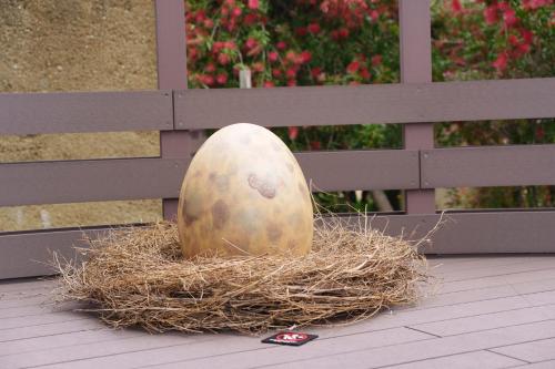 a pumpkin sitting in a nest in a fence at GRAND CHARIOT Hokutoshichisei 135° in Awaji