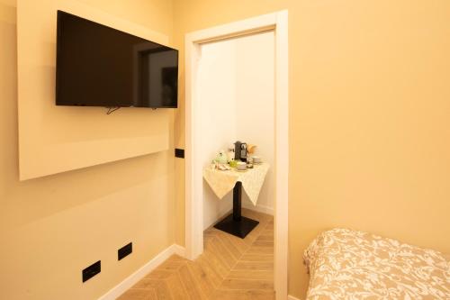 TV a/nebo společenská místnost v ubytování La Pregnana House Fiera Milano