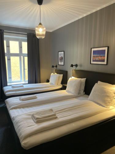 Кровать или кровати в номере Unique Hotel