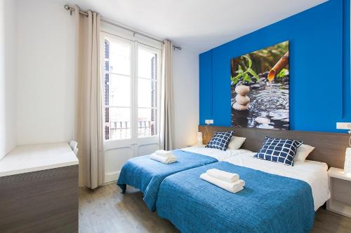 En eller flere senge i et værelse på AB Nou de la Rambla