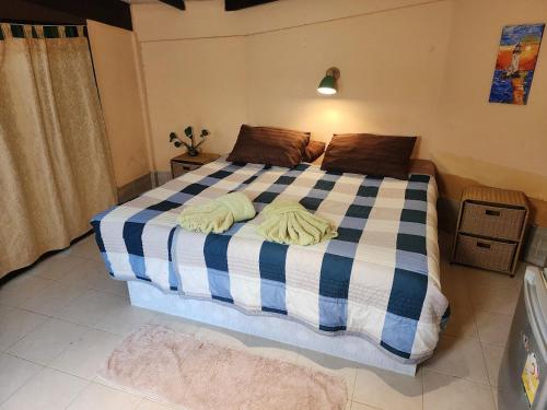 a bedroom with a bed with two towels on it at RELAX ECO Life Center-Khao Lak in Khao Lak