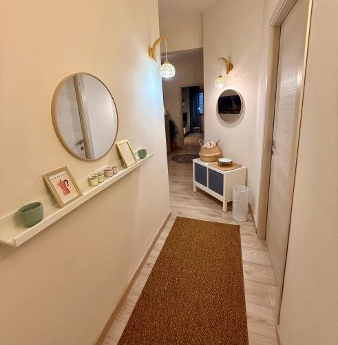 a hallway with a mirror and a dressing room at Twin Homes - Tamerò Estates in Poggio Mirteto