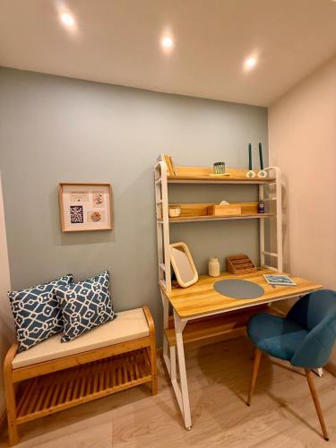 a room with a desk and a chair and a shelf at Twin Homes - Tamerò Estates in Poggio Mirteto