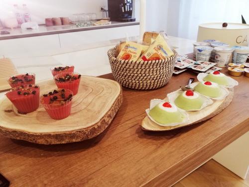 a table with two plates of desserts on it at B&B Magnolie in Palermo