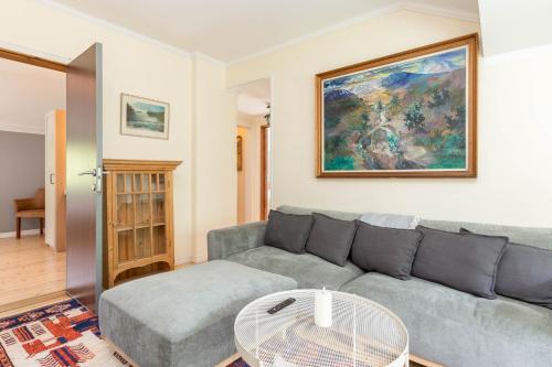 a living room with a couch and a table at Åre Travel - Villa Årebo in Åre