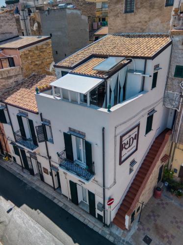 an overhead view of a white building with a balcony at VFH La Rada Apartments in Santa Flavia