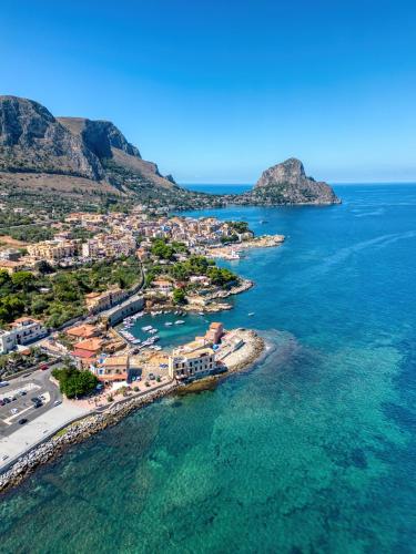 an aerial view of a town on the ocean at VFH La Rada Apartments in Santa Flavia