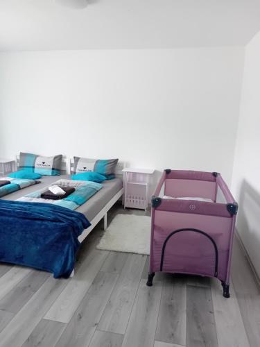 a bedroom with a bed and a dresser at Ferienwohnung in Arrach