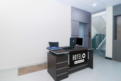 an office with a desk with a computer on it at Hotel O Ranchi Station Near Rajendra Chowk in Rānchī
