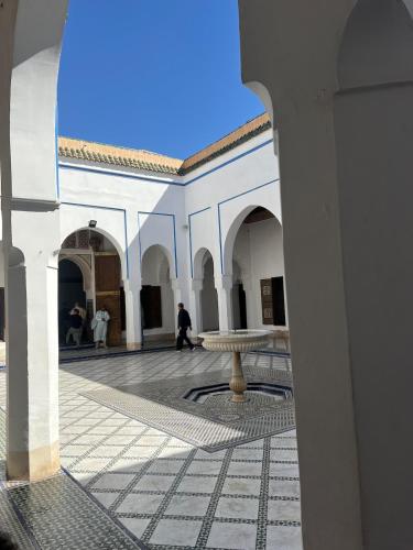 a building with a fountain in the middle of a courtyard at Riad Jonan & Spa in Marrakech