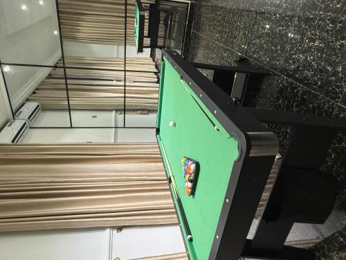 a stair case with a green in a room at Cedar Pine Home A Secure 3 Bedroom House in a Private Gated Compound Ikorodu in Ikorodu