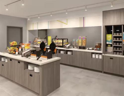 a fast food restaurant with a counter with food at Home2 Suites By Hilton Del Rio in Del Rio
