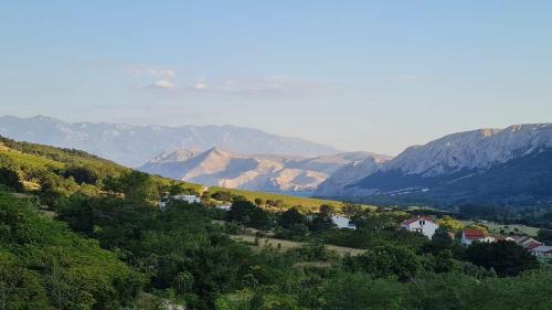 a view of a valley with mountains in the background at Draga studio apartment pets welcome in Draga Bašćanska