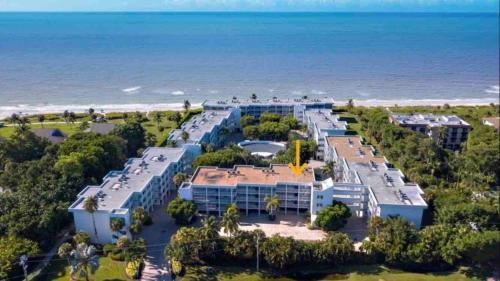 an aerial view of the resort and the beach at Island Beach Club - steps to the Gulf! in Sanibel