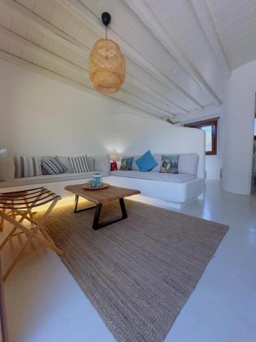 a living room with a couch and a coffee table at Divers House in Agrari