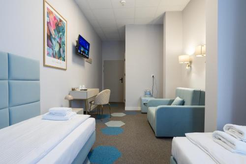 Postel nebo postele na pokoji v ubytování Moon ApartHotel