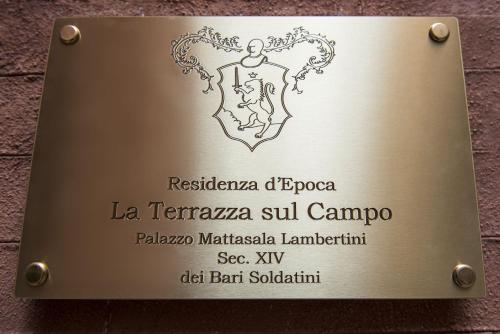 a sign for a restaurant in a building at La Terrazza Sul Campo-Rooms Only in Siena