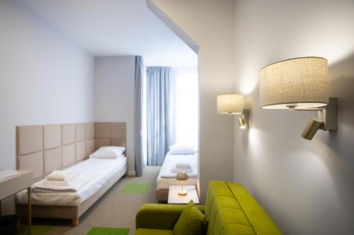 Postel nebo postele na pokoji v ubytování Moon ApartHotel
