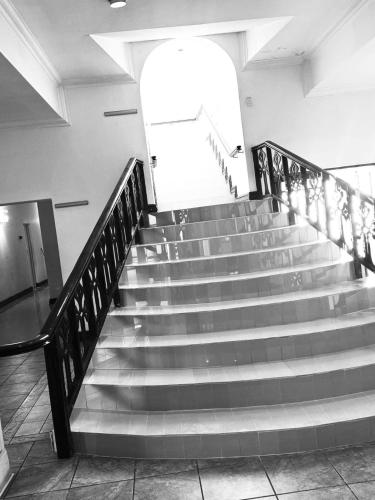 a group of stairs in a building at Sapphire Hotel Halevy Heritage in Bloemfontein