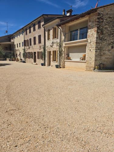an empty street in front of a building at Le Perine 6 in Valdobbiadene