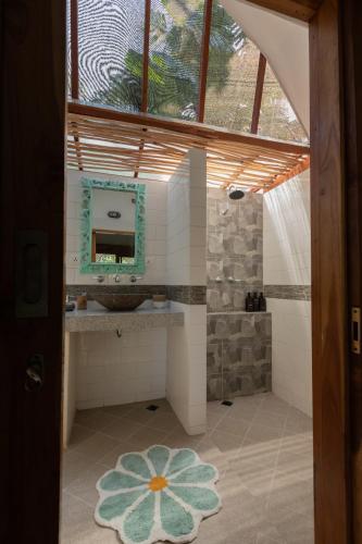 a bathroom with a sink and a mirror at The New Gili Kolanta Indah in Gili Air