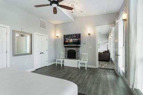 a white room with a bed and a fireplace at 5BR Penthouse with Amenities Near FQ in New Orleans