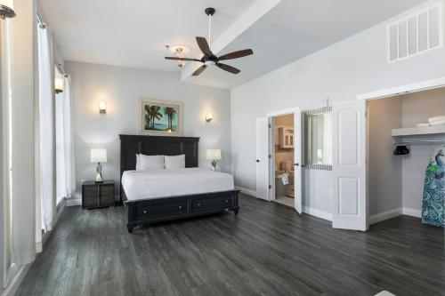a bedroom with a bed and a ceiling fan at 5BR Penthouse with Amenities Near FQ in New Orleans