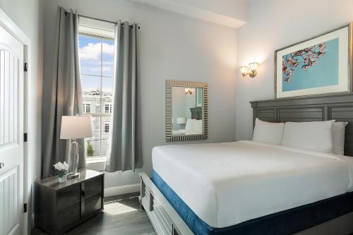 a bedroom with a large bed and a window at 5BR Penthouse with Amenities Near FQ in New Orleans