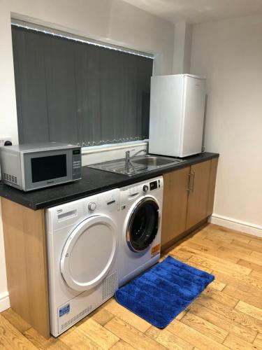 Kuchyň nebo kuchyňský kout v ubytování Ellington Apartment