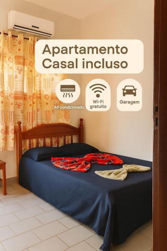 a bed in a room with a sign for an appliancecci institute at HOTEL TAPAJOS Marabá in Marabá