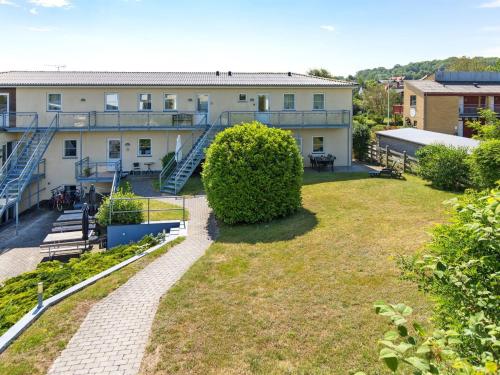 an aerial view of a building with a yard at Apartment Gjuro - 50m from the sea by Interhome in Allinge