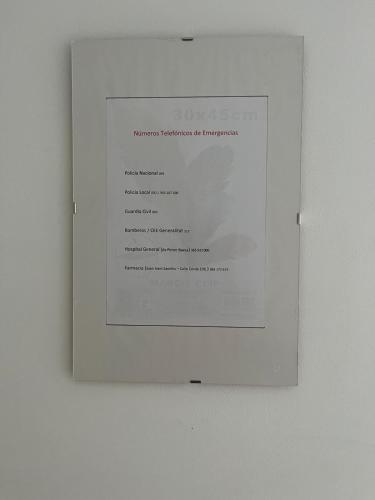 a picture of a document on a wall at Pensiòn Cerdà 112 in Alicante
