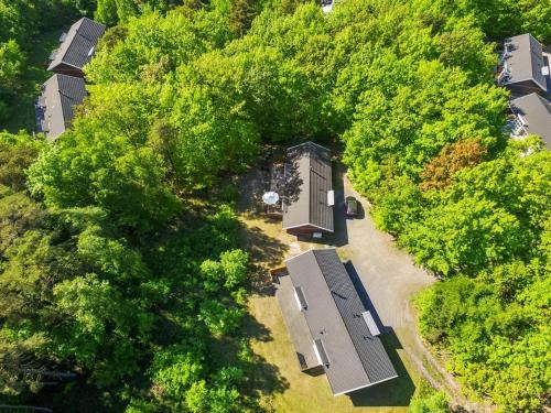 an overhead view of a building in the midst of trees at Holiday Home Verner - 500m from the sea by Interhome in Hasle