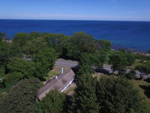 an overhead view of a road next to the ocean at Holiday Home Nyyrikki - 100m from the sea by Interhome in Gudhjem