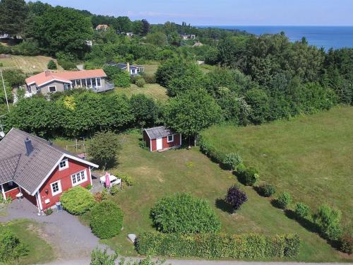 an aerial view of a house on a field at Holiday Home Spurgh - 250m from the sea by Interhome in Allinge