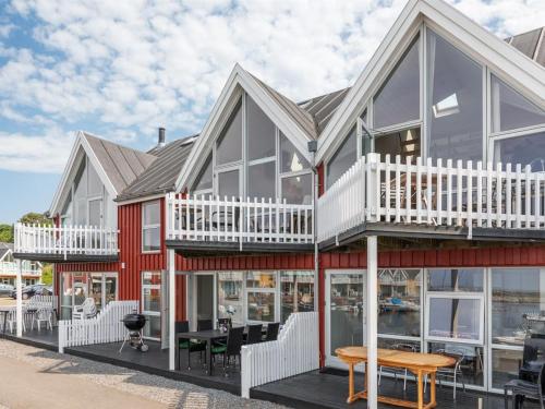 a home with a red and white house at Holiday Home Eija - 5m from the sea by Interhome in Hasle