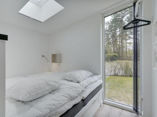 Ένα ή περισσότερα κρεβάτια σε δωμάτιο στο Apartment Wehrhart - 200m from the sea by Interhome