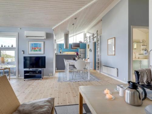 a living room with a couch and a table at Holiday Home Tjelle - 300m from the sea by Interhome in Allinge